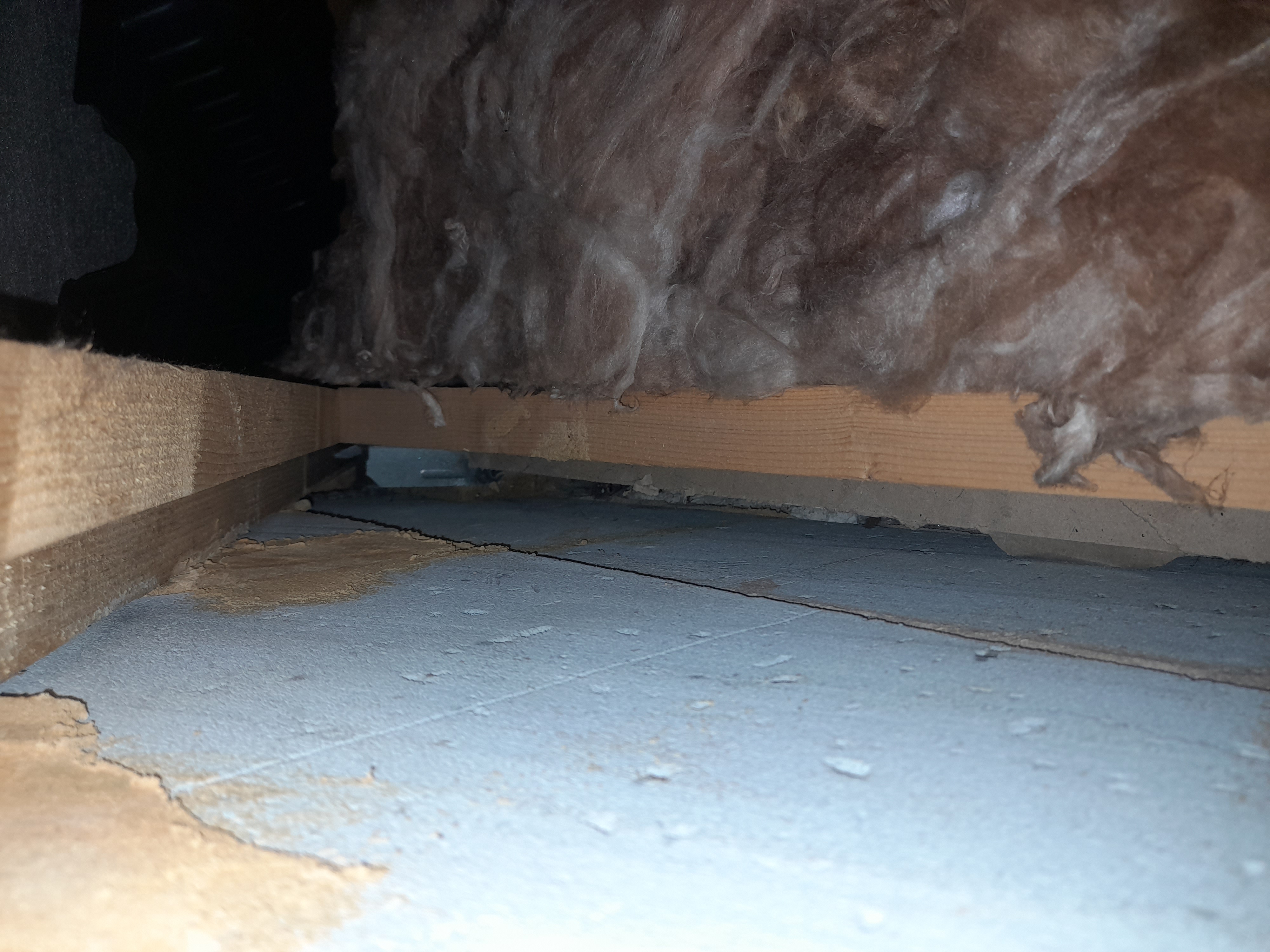 Fig. 4: Large gap between the loft insulation and the party wall, resulting in mould growth on the ceiling in the room below. Fig. 4: Large gap between the loft insulation and the party wall, resulting in mould growth on the ceiling in the room below.